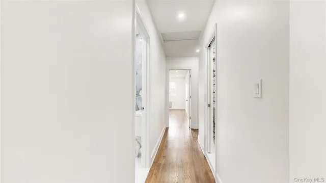 a view of a hallway with a white walls