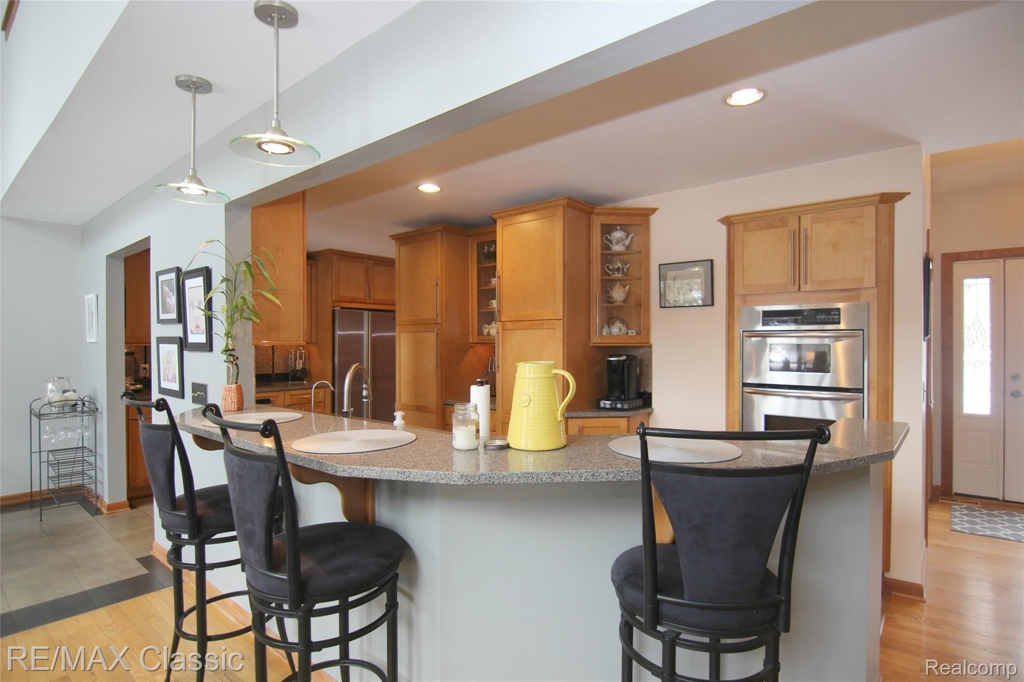 2059 Addaleen Road Highland, MI 48357 - Photo 8 of 33 jAddaleen Rd Designer Kitchen offers bar seating.