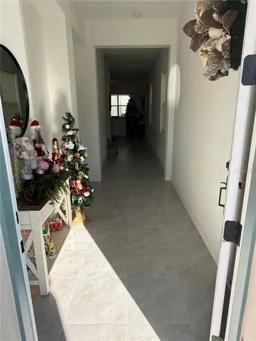 a view of a hallway with a flower pot