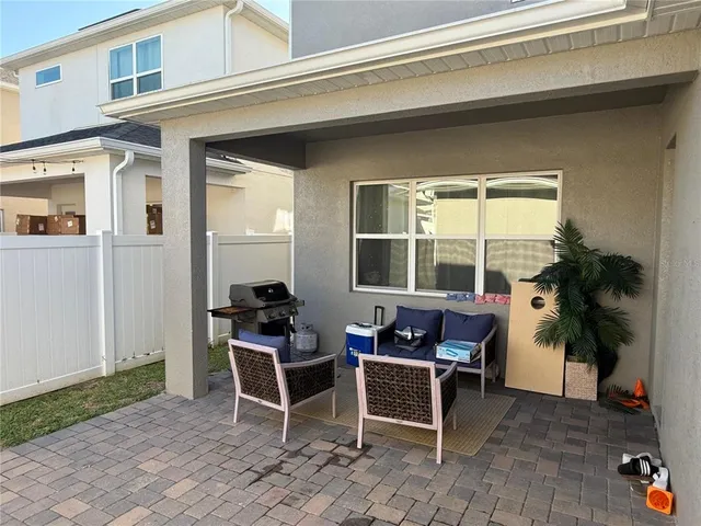 a bathroom with a granite countertop toilet a sink and mirror