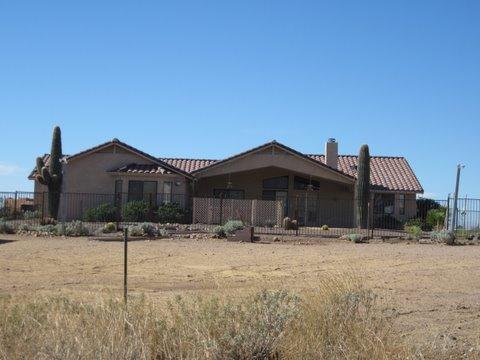980 North Hilton Road Apache Junction, AZ 85119 - Photo 1 of 12 a front view of a house with a yard