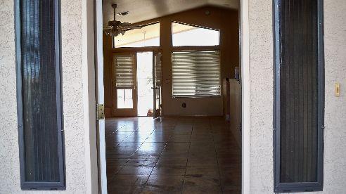 980 North Hilton Road Apache Junction, AZ 85119 - Photo 5 of 12 a view of an empty room and window