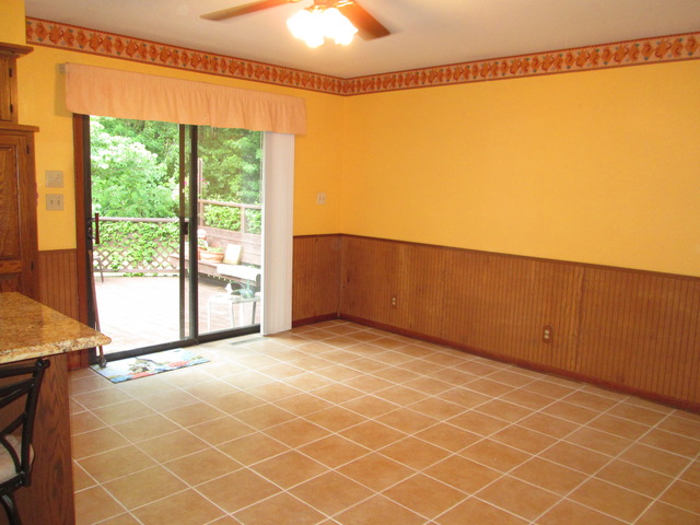 600 Schoolgate Road New Lenox, IL 60451 - Photo 11 of 24 a view of an empty room with a window and a ceiling fan