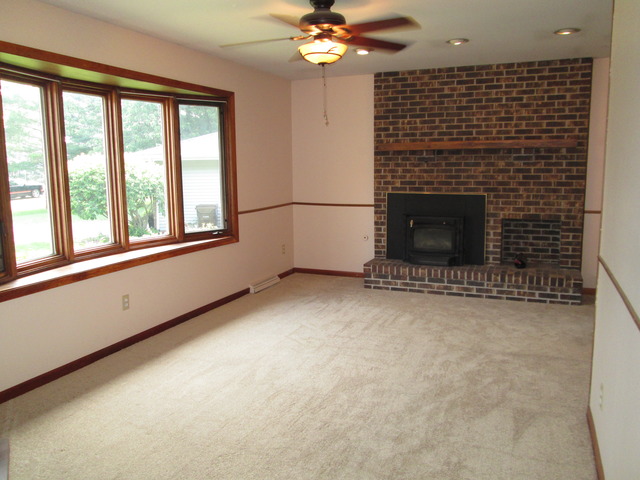 600 Schoolgate Road New Lenox, IL 60451 - Photo 21 of 24 wooden floor in an empty room with a fireplace