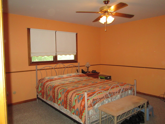 600 Schoolgate Road New Lenox, IL 60451 - Photo 8 of 24 a bed sitting in a bedroom next to a window