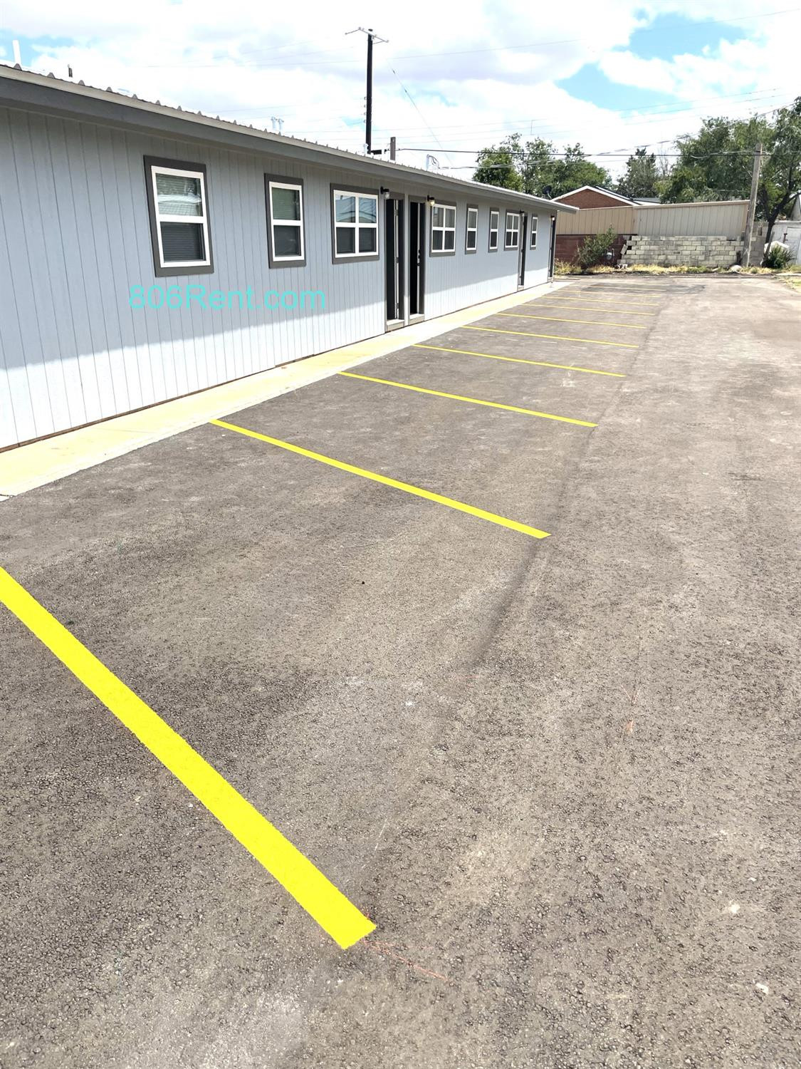 1201 36th Street, Unit C Lubbock, TX 79412 - Photo 2 of 7 a swimming pool with an outdoor seating and a yard