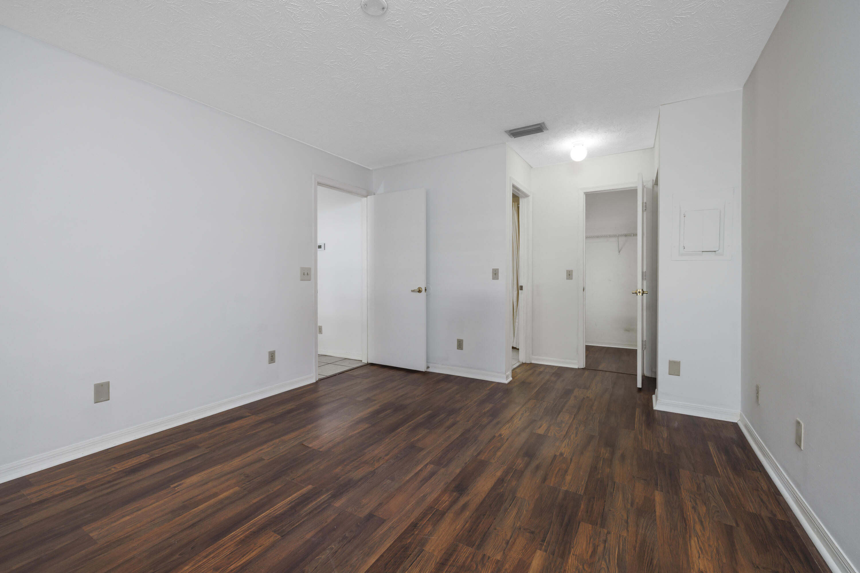 6541 Southeast Federal Highway, Unit 101 Stuart, FL 34997 - Photo 16 of 30 a view of room with wooden floor