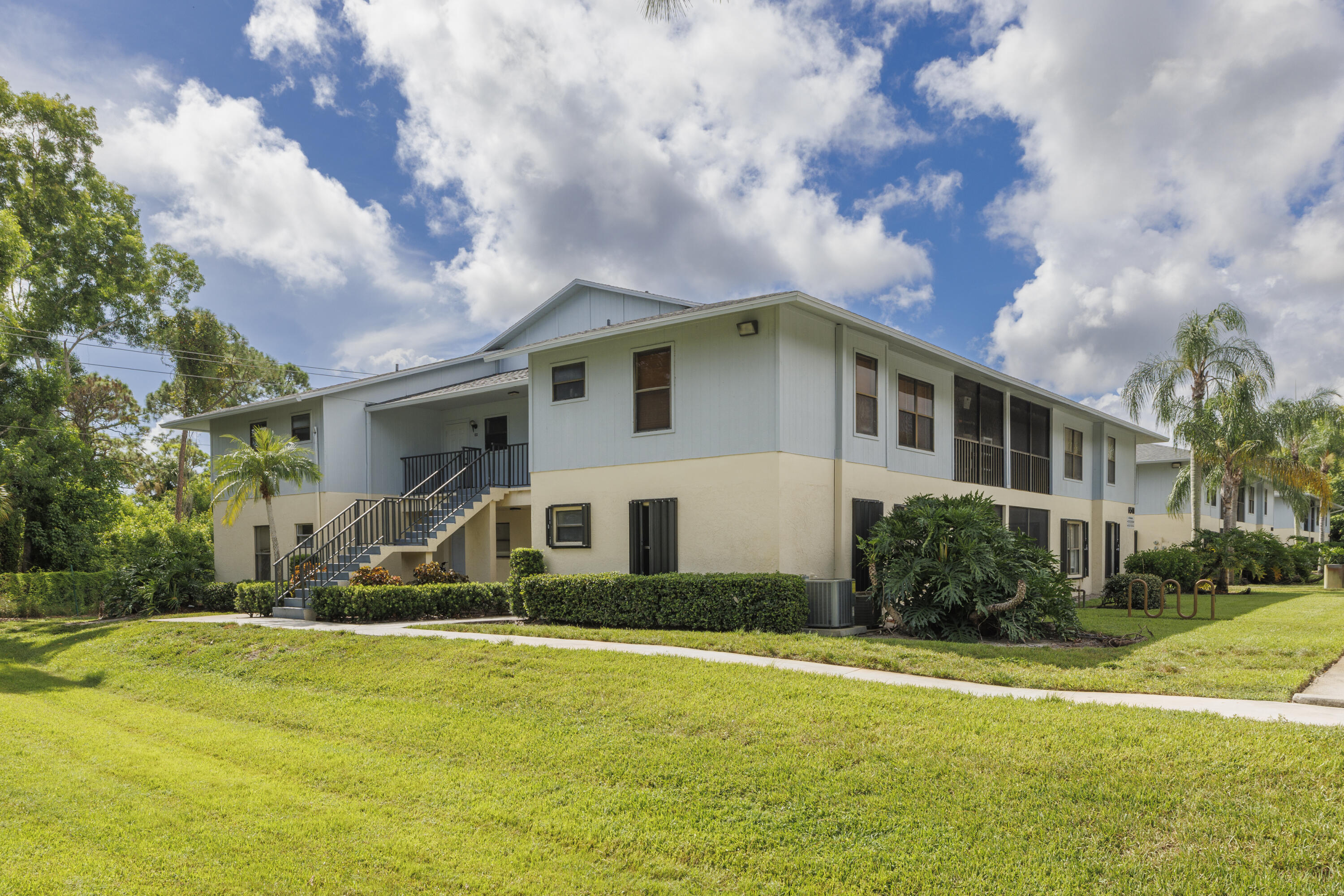 6541 Southeast Federal Highway, Unit 101 Stuart, FL 34997 - Photo 2 of 30 a view of a house with a yard