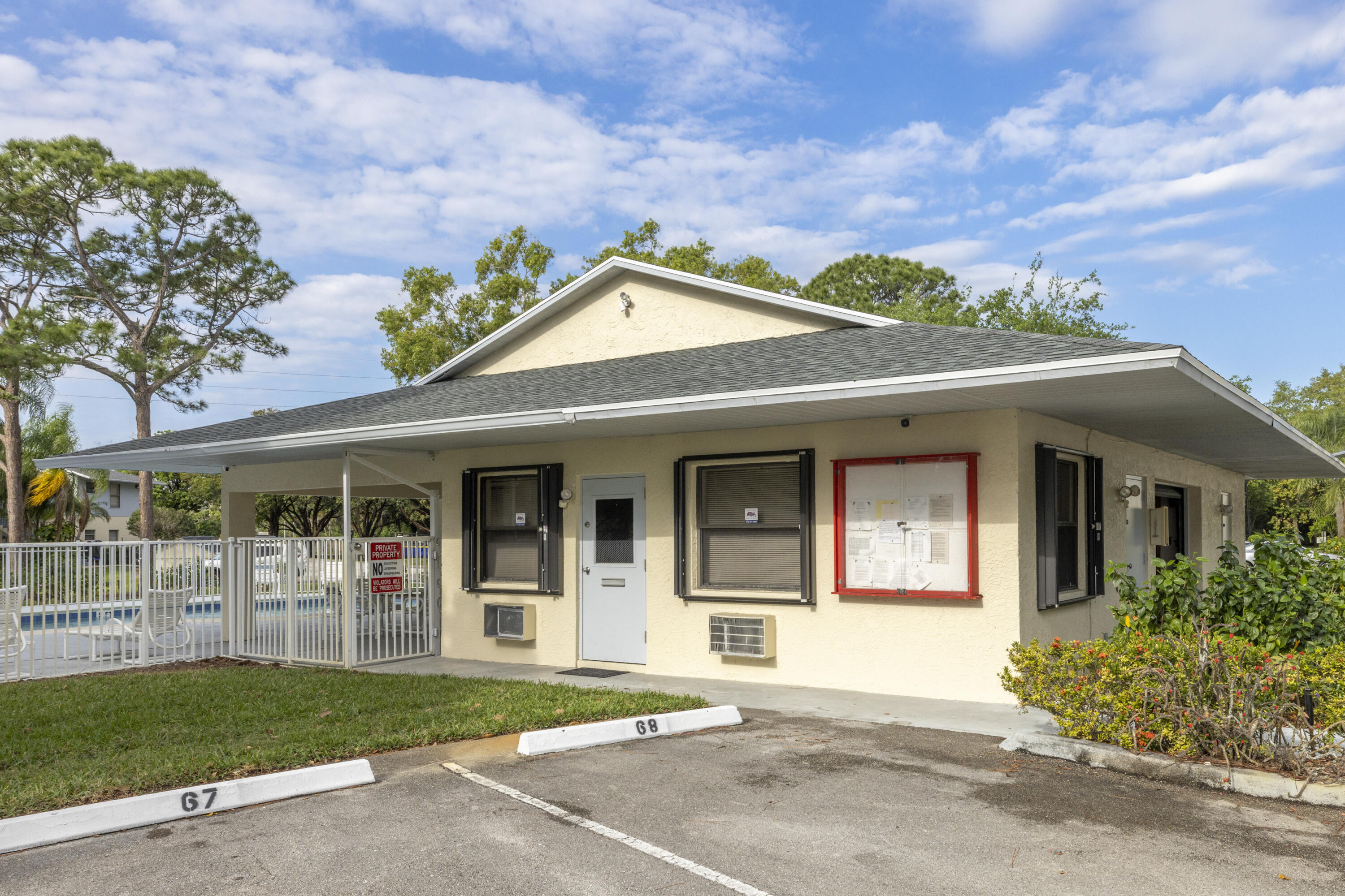 6541 Southeast Federal Highway, Unit 101 Stuart, FL 34997 - Photo 23 of 30 front view of a house with a garden