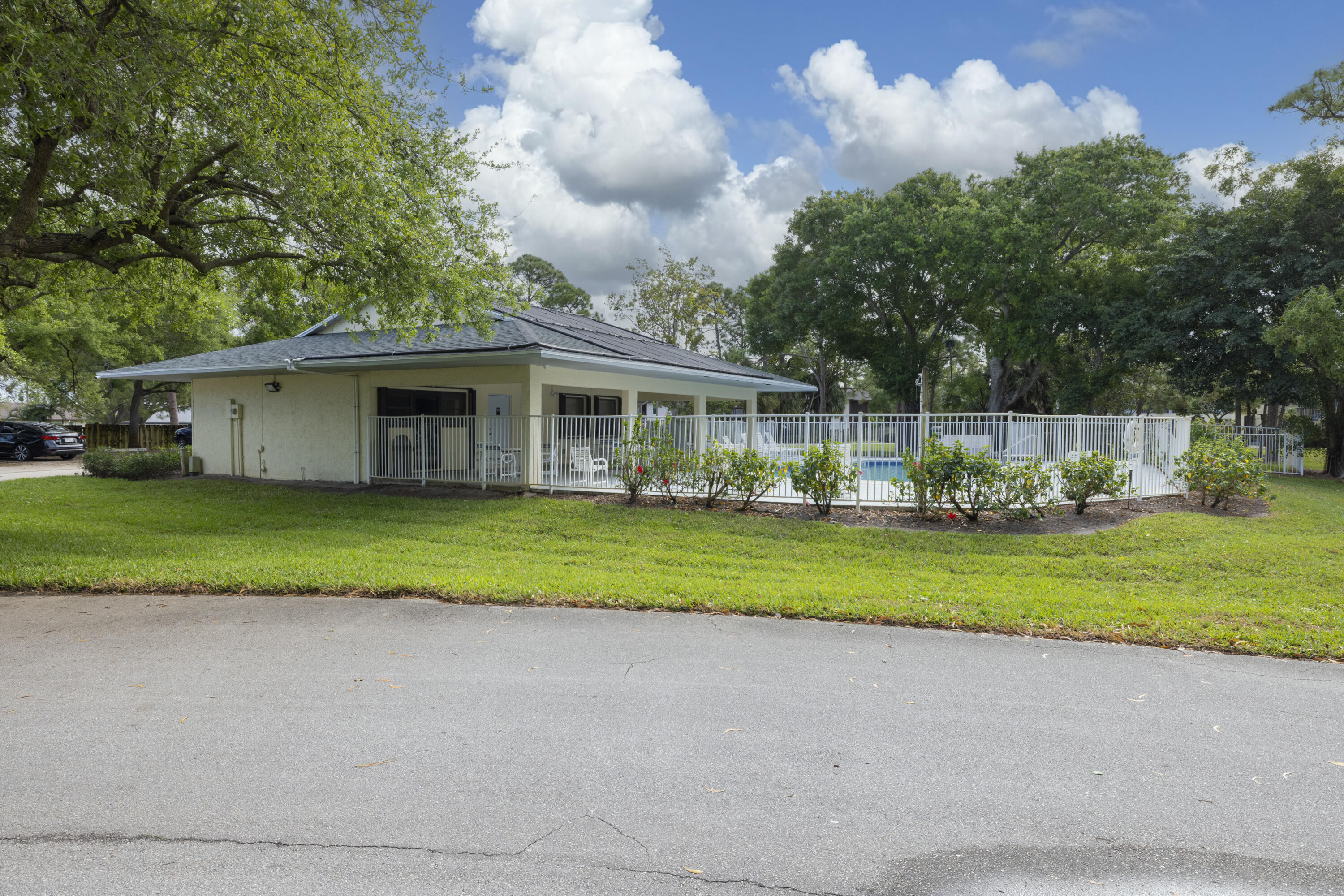 6541 Southeast Federal Highway, Unit 101 Stuart, FL 34997 - Photo 24 of 30 a front view of house with yard and green space