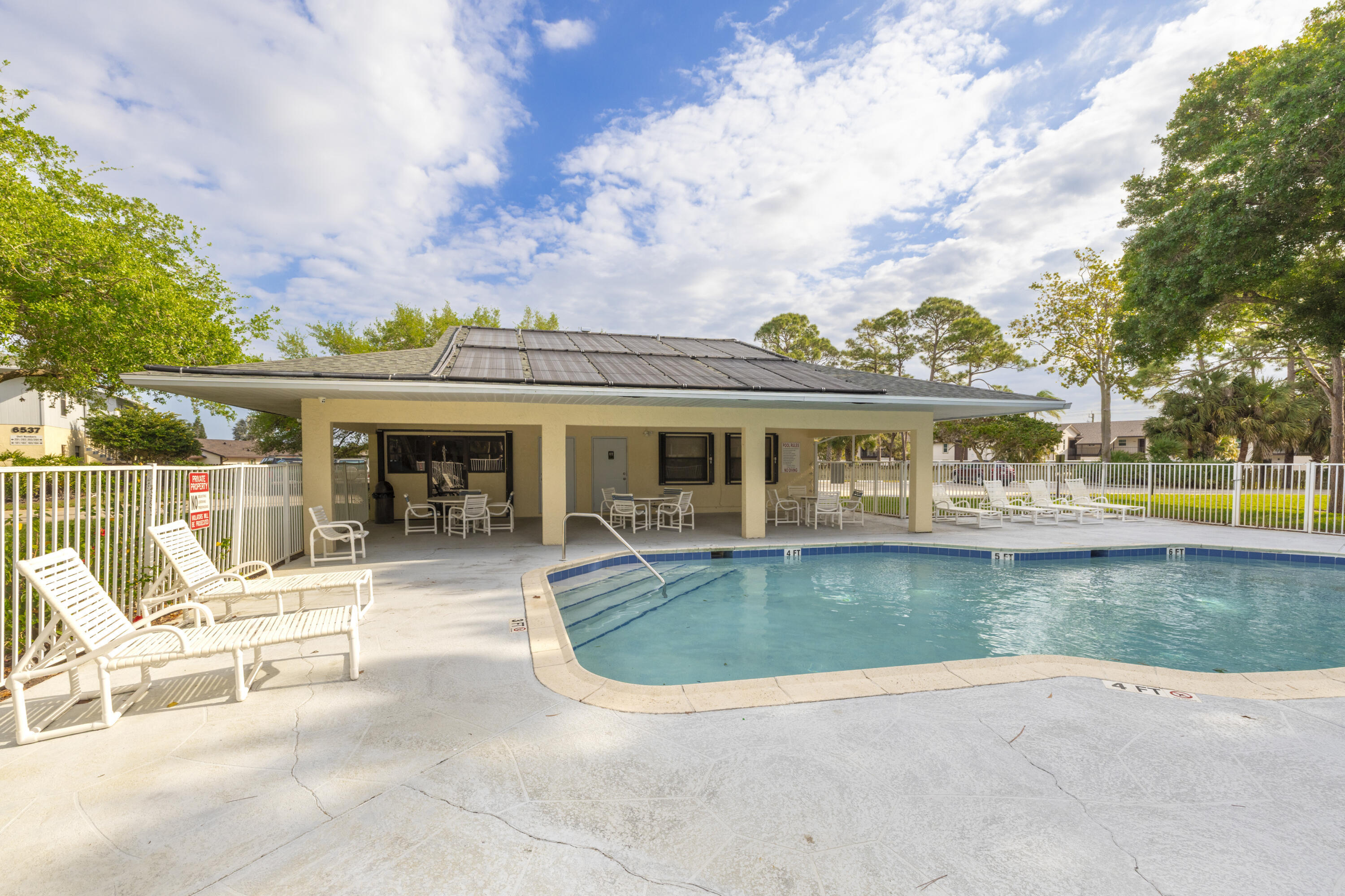 6541 Southeast Federal Highway, Unit 101 Stuart, FL 34997 - Photo 26 of 30 swimming pool view with seating space