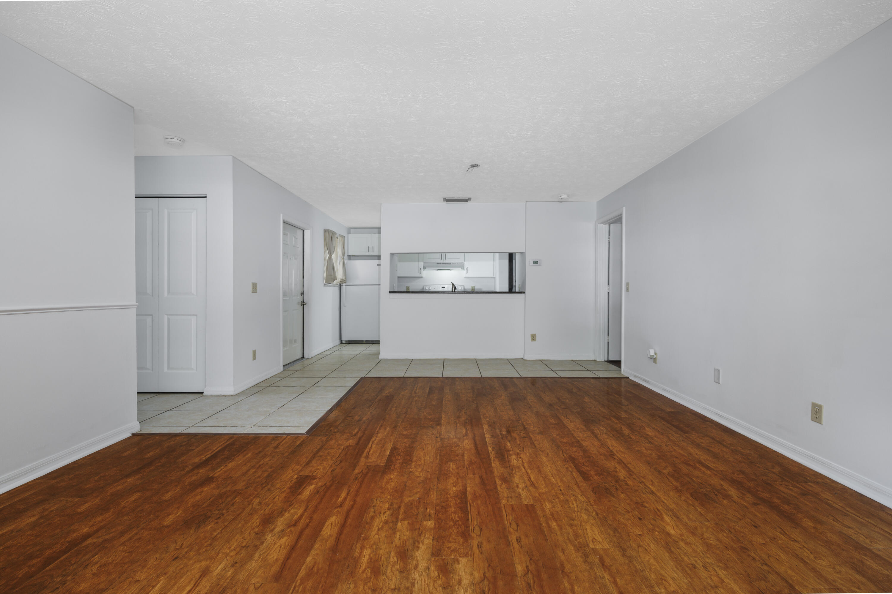 6541 Southeast Federal Highway, Unit 101 Stuart, FL 34997 - Photo 7 of 30 a view of empty room with wooden floor