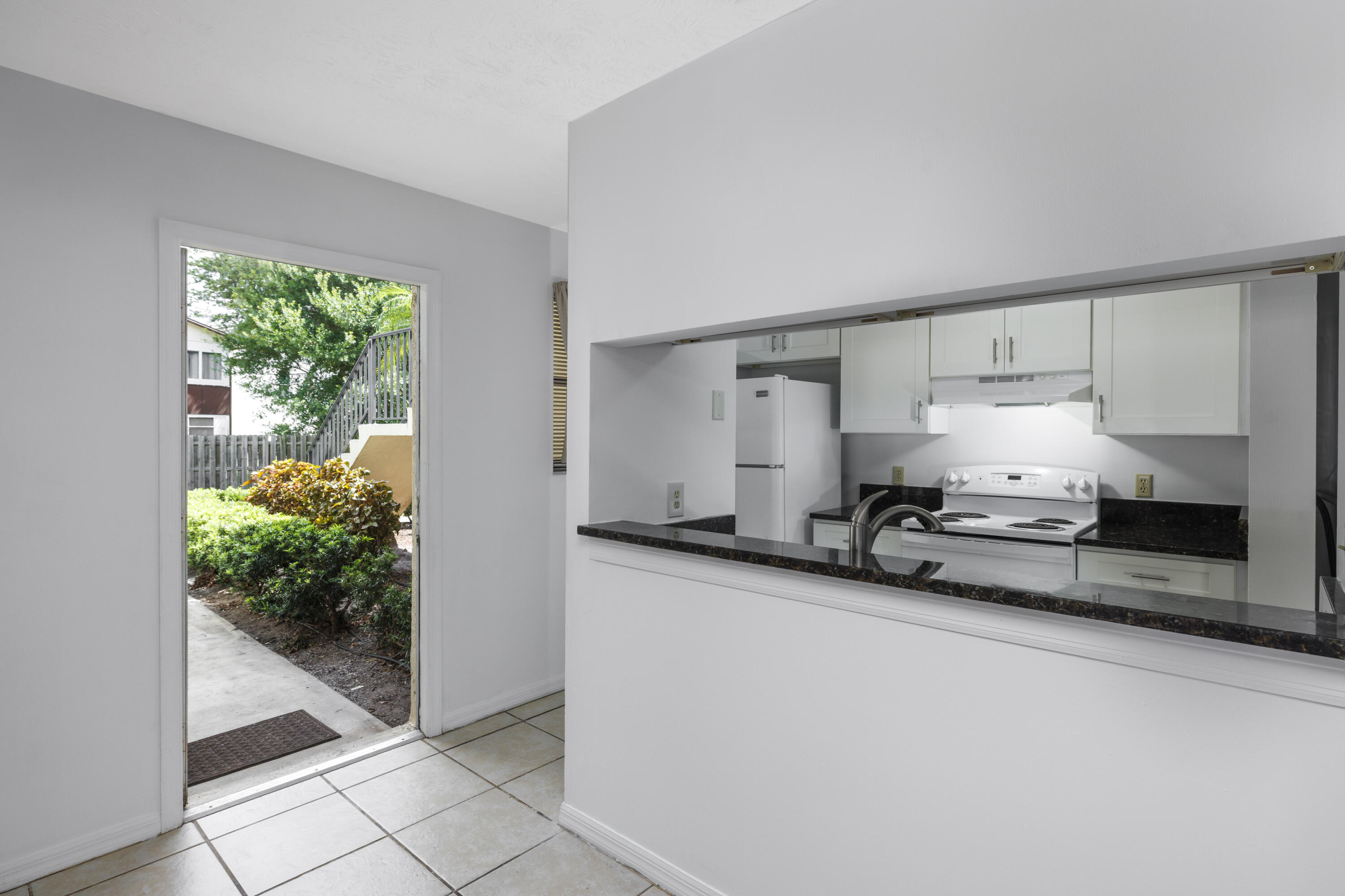 6541 Southeast Federal Highway, Unit 101 Stuart, FL 34997 - Photo 8 of 30 a room with storage and utility