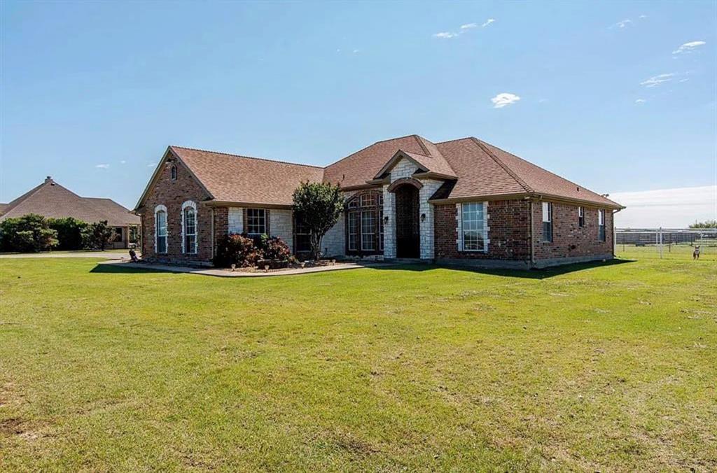 10899 Jackson Road Krum, TX 76249 - Photo 1 of 11 View of front facade featuring brick siding and roof with shingles