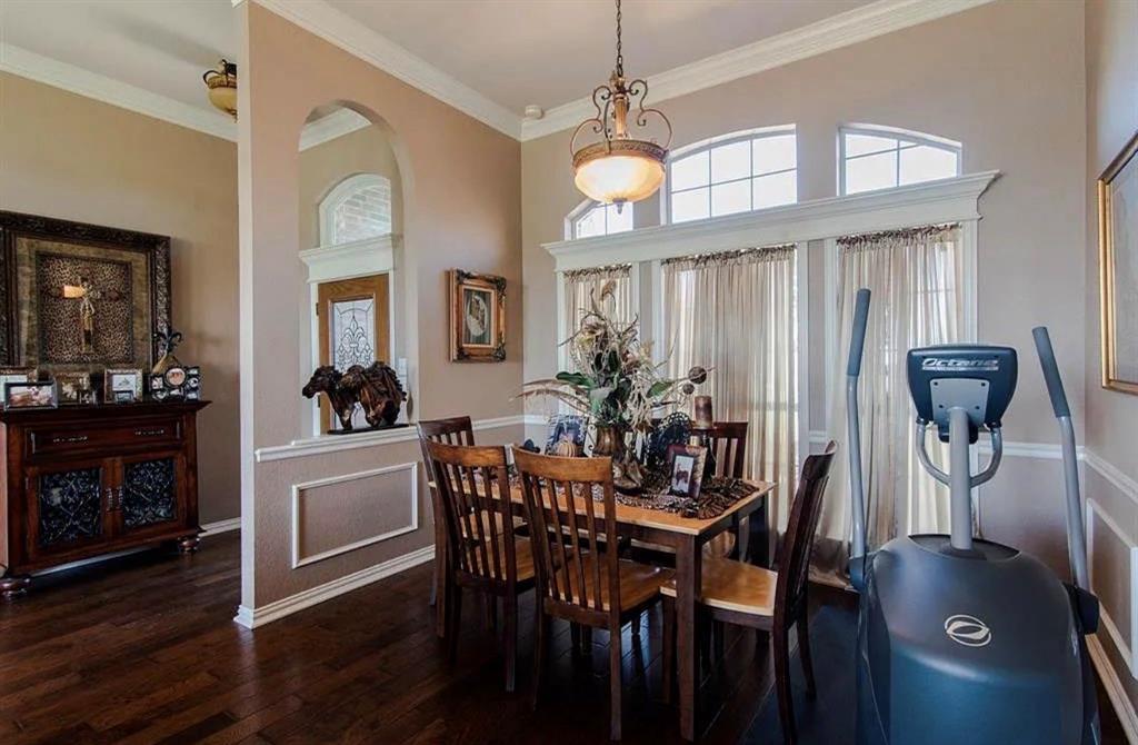 10899 Jackson Road Krum, TX 76249 - Photo 11 of 11 Dining room featuring dark wood finished floors and crown molding
