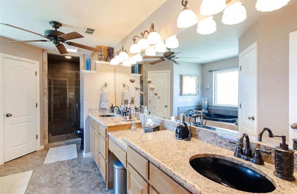 10899 Jackson Road Krum, TX 76249 - Photo 6 of 11 Full bath featuring ceiling fan, double vanity, a shower stall, and a garden tub