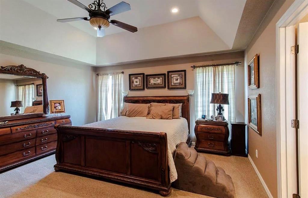 10899 Jackson Road Krum, TX 76249 - Photo 8 of 11 Bedroom with light carpet, a ceiling fan, recessed lighting, and lofted ceiling