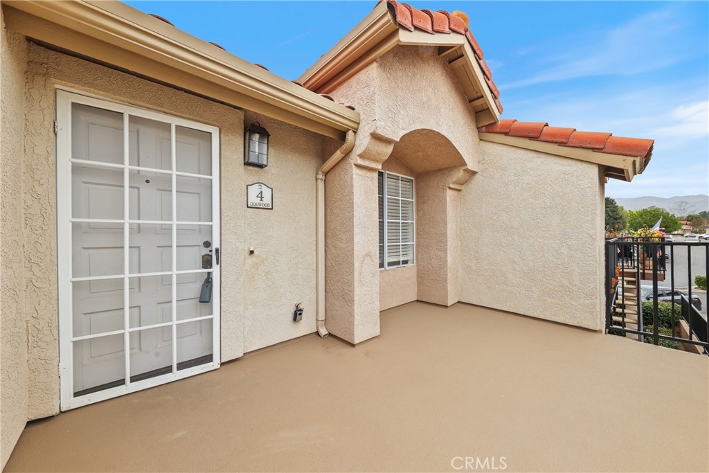4 Dogwood Rancho Santa Margarita, CA 92688 - Photo 2 of 18 a view of a house with a yard and garage