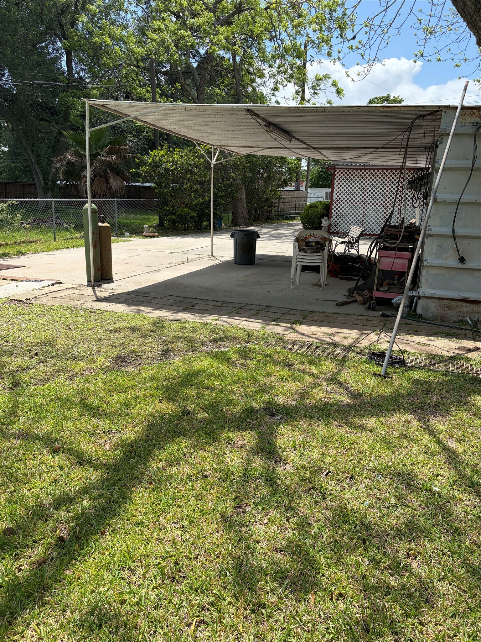 817 South Main Street Highlands, TX 77562 - Photo 12 of 17 a backyard of a house with table and chairs
