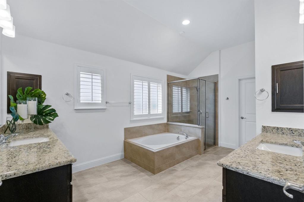 4220 Harper Avenue Celina, TX 75009 - Photo 12 of 20 a spacious bathroom with a granite countertop tub and a sink