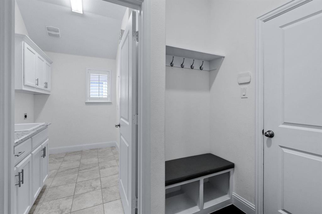 4220 Harper Avenue Celina, TX 75009 - Photo 17 of 20 a room that has a bed and a chair in it