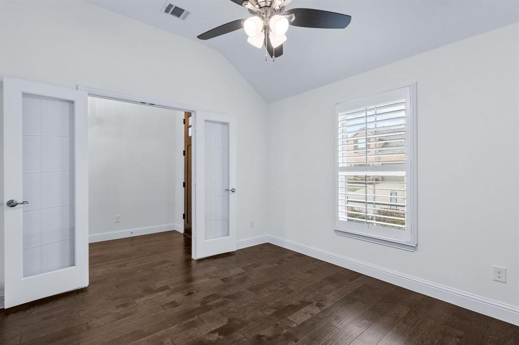 4220 Harper Avenue Celina, TX 75009 - Photo 4 of 20 a view of an empty room with wooden floor and a window