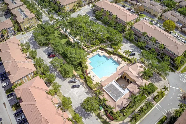 an aerial view of a house with a garden
