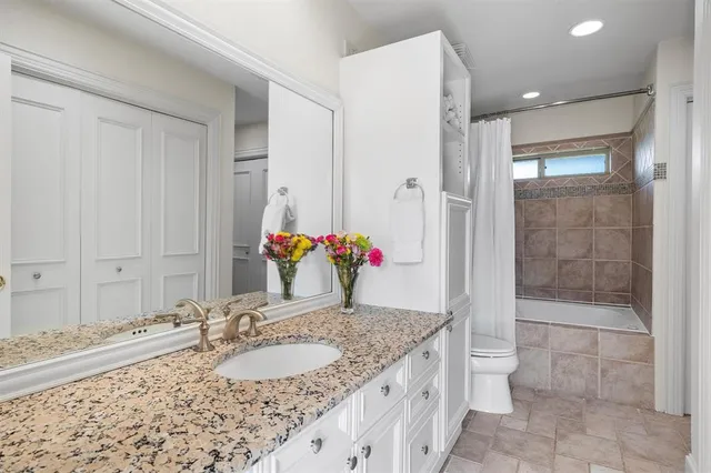 a front view of a house with swimming pool having outdoor seating