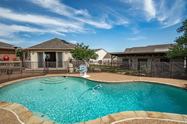 a view of a porch with furniture and a ceiling fan