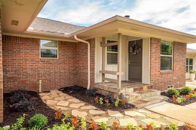 a living room with furniture fireplace and flat screen tv