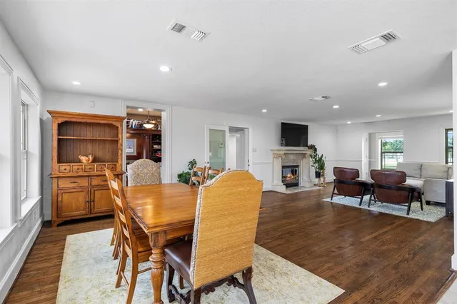 a kitchen with stainless steel appliances kitchen island granite countertop a refrigerator and cabinets
