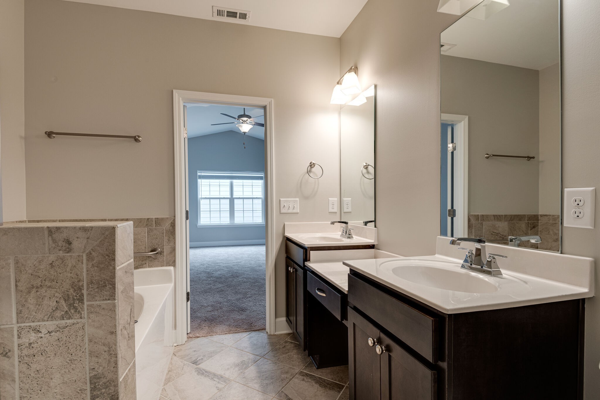 269 Mary Ann Circle Spring Hill, TN 37174 - Photo 16 of 28 a bathroom with a sink and a mirror