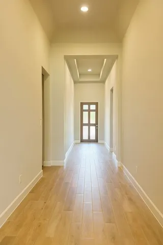 an empty room with a bathroom and a sink