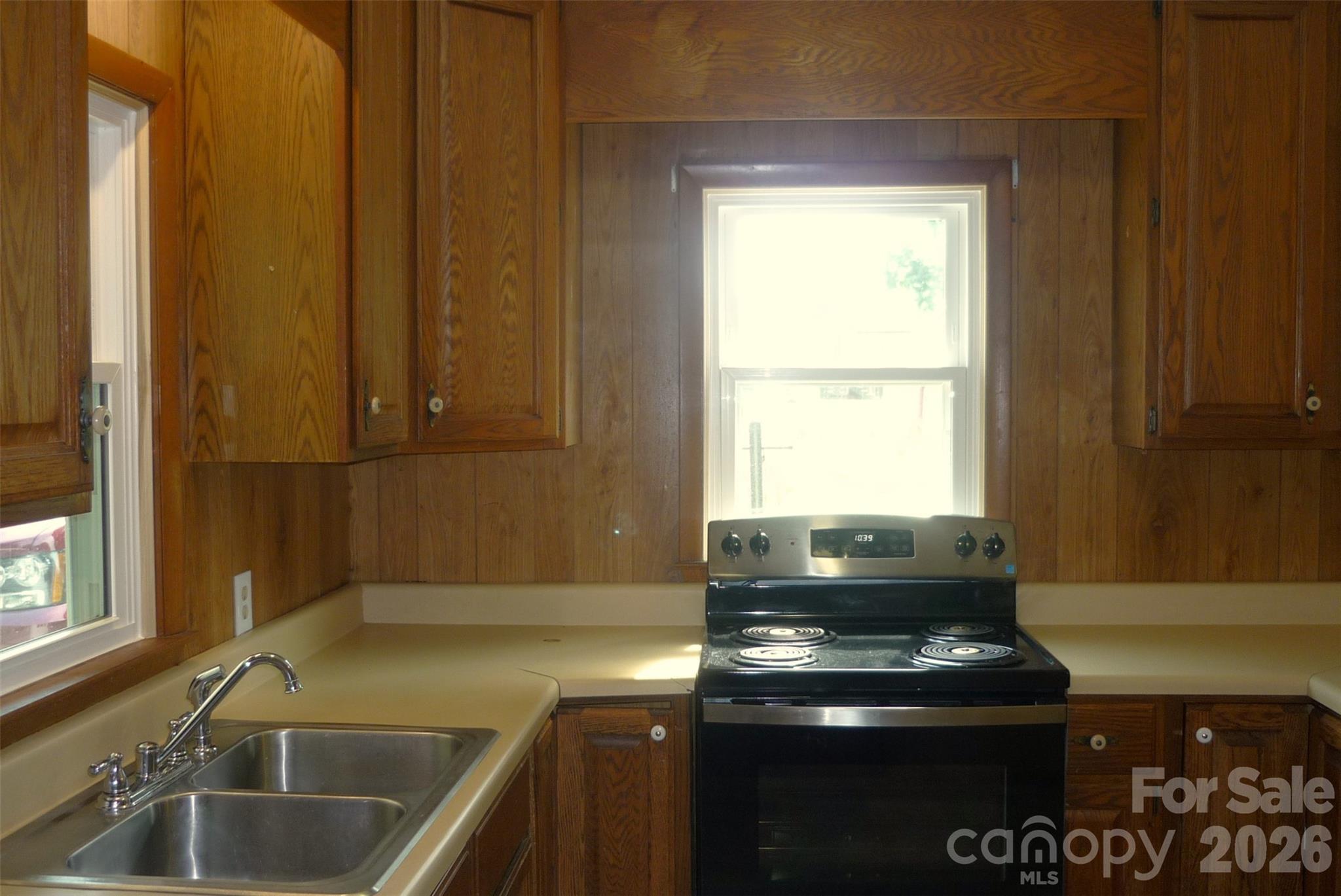 120 Bradley Road Shelby, NC 28152 - Photo 13 of 42 a kitchen with a sink a stove and a window