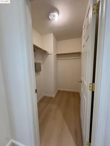 an empty room with a wooden door