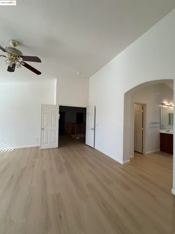 a view of empty room with a fireplace