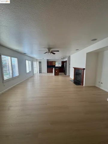 a kitchen with stainless steel appliances granite countertop a sink a stove a refrigerator a washer and dryer