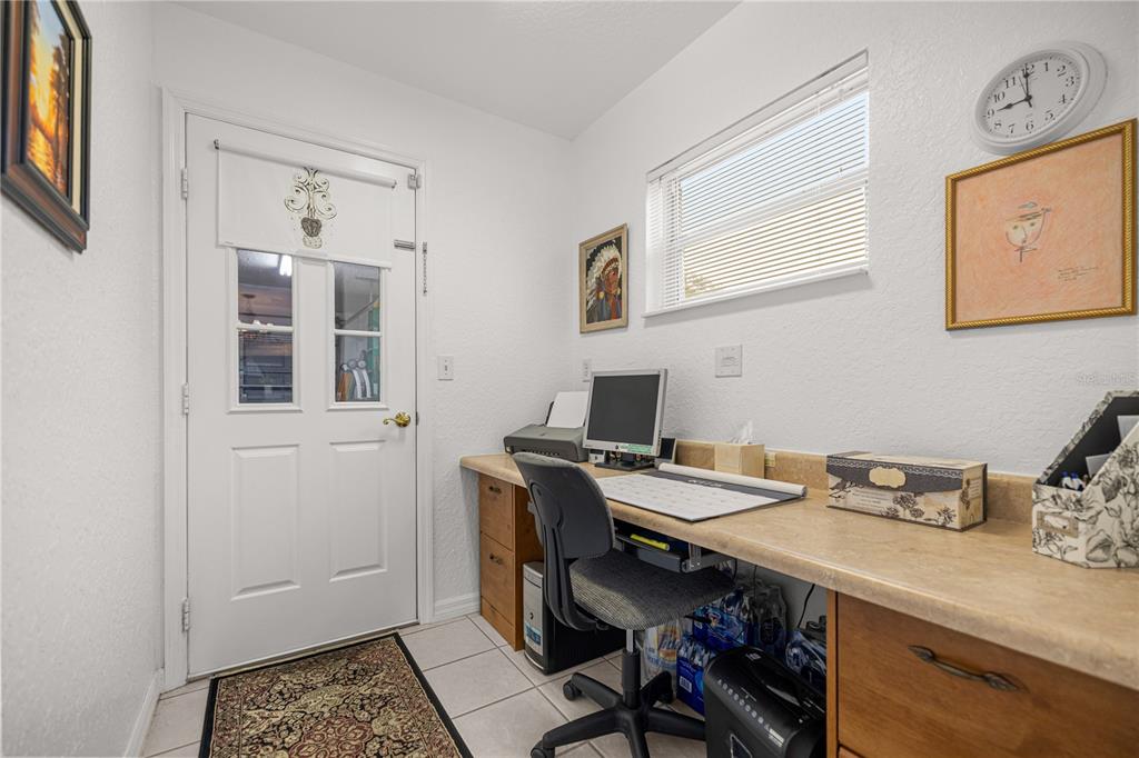 11298 Southwest 73rd Circle Ocala, FL 34476 - Photo 12 of 14 a view of a workspace with furniture and wooden floor