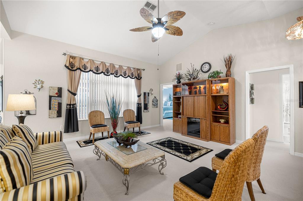 11298 Southwest 73rd Circle Ocala, FL 34476 - Photo 3 of 14 a living room with furniture and wooden floor