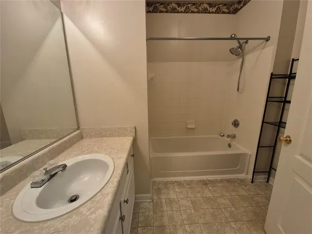 a bathroom with a sink and a vanity