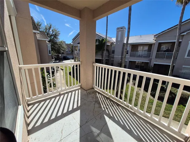 a view of balcony with a deck