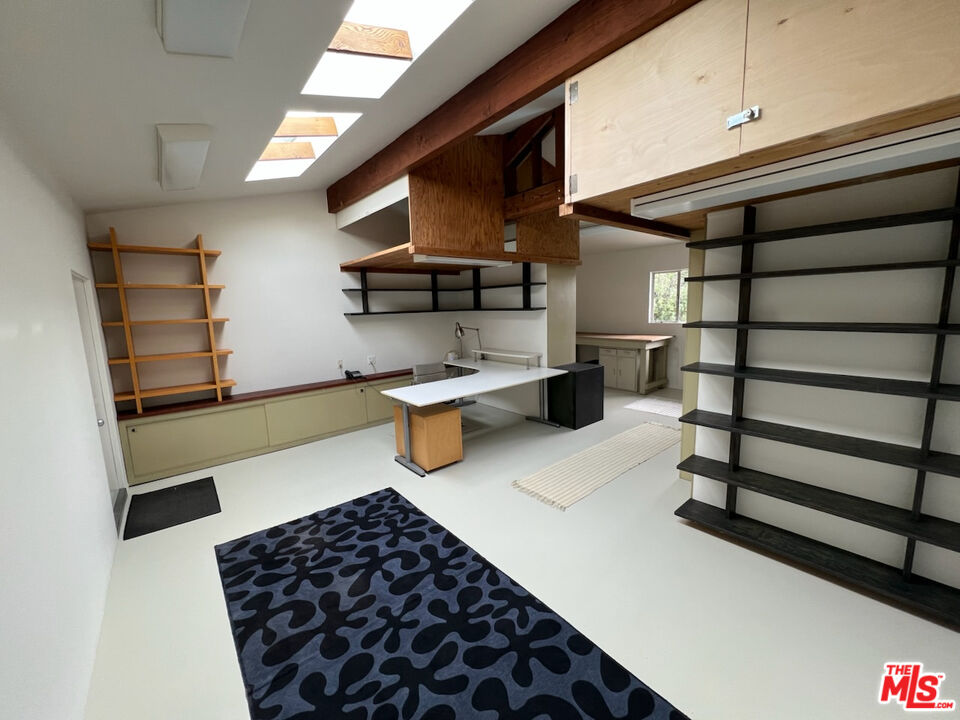 254 Tranquillo Road Pacific Palisades, CA 90272 - Photo 12 of 16 a kitchen with stainless steel appliances granite countertop a refrigerator and a sink