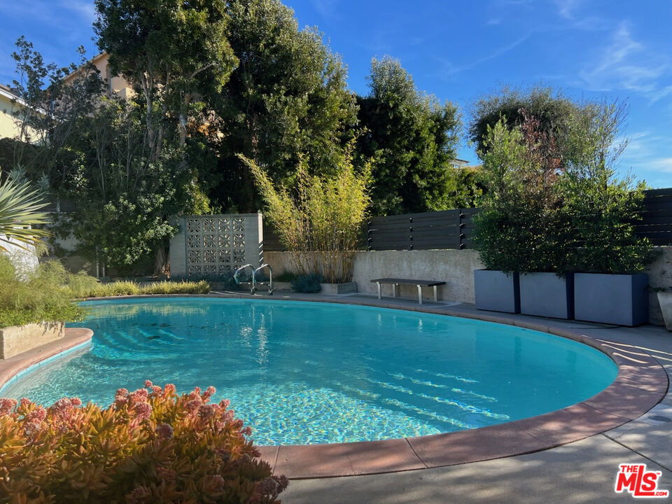 254 Tranquillo Road Pacific Palisades, CA 90272 - Photo 13 of 16 a view of a swimming pool with a yard