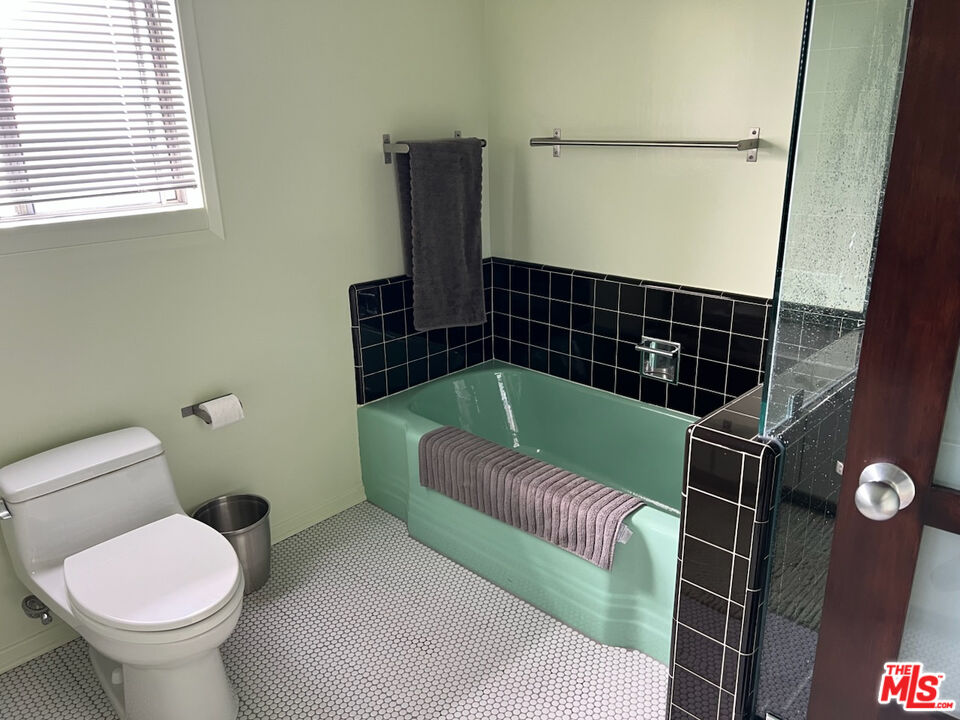 254 Tranquillo Road Pacific Palisades, CA 90272 - Photo 10 of 16 a bathroom with a toilet and a shower