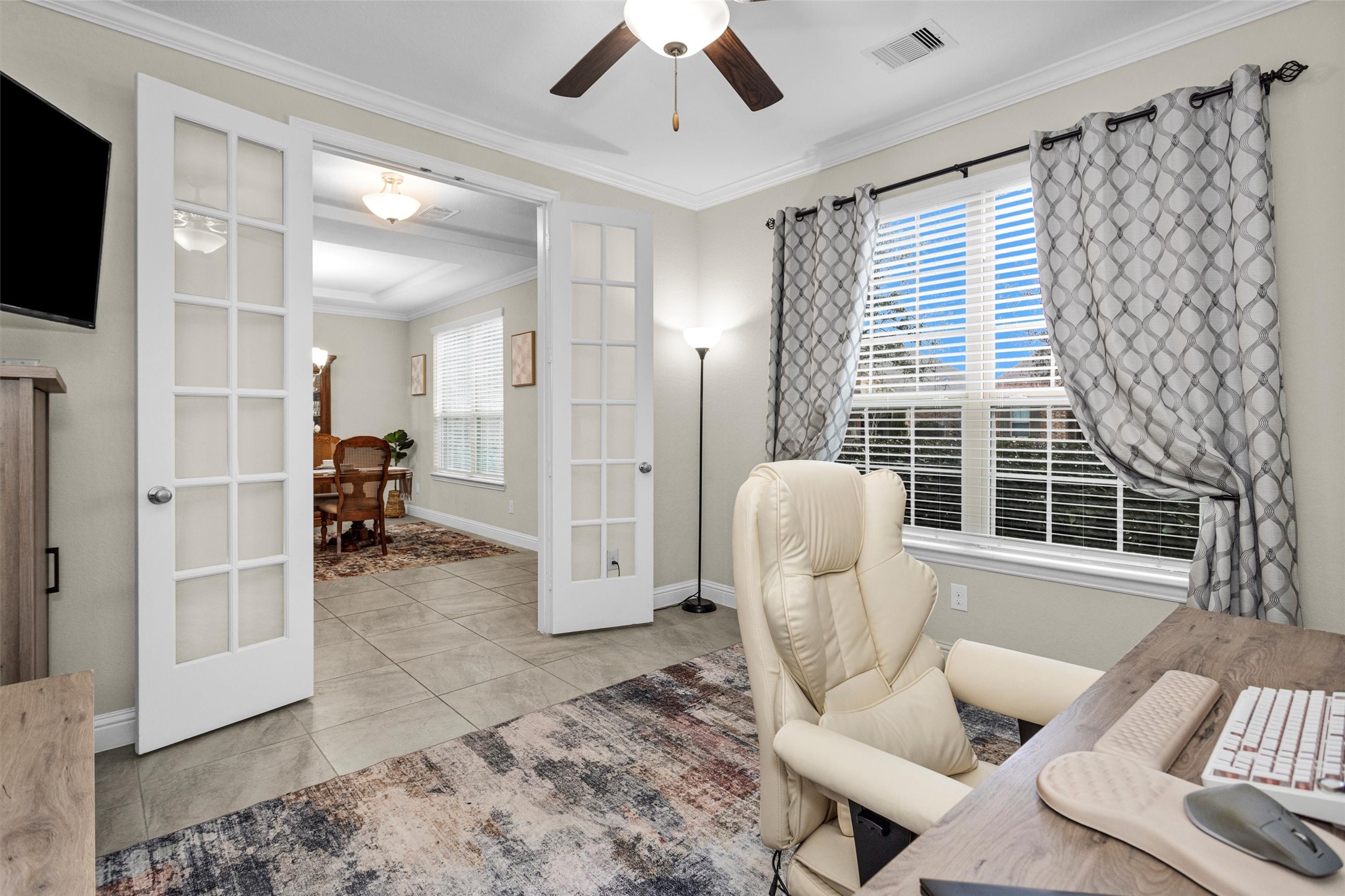 3622 Lister Drive Rosharon, TX 77583 - Photo 9 of 44 a living room with furniture a flat screen tv and a large window