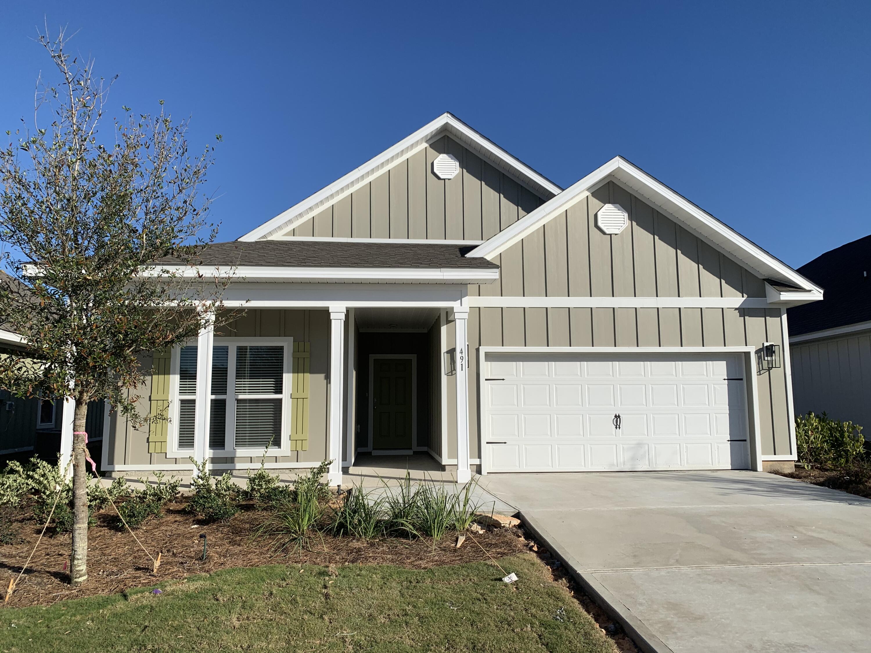 491 Lightning Bug Lane, Unit LOT 11 Freeport, FL 32439 - Photo 1 of 34 front view of a house with a yard