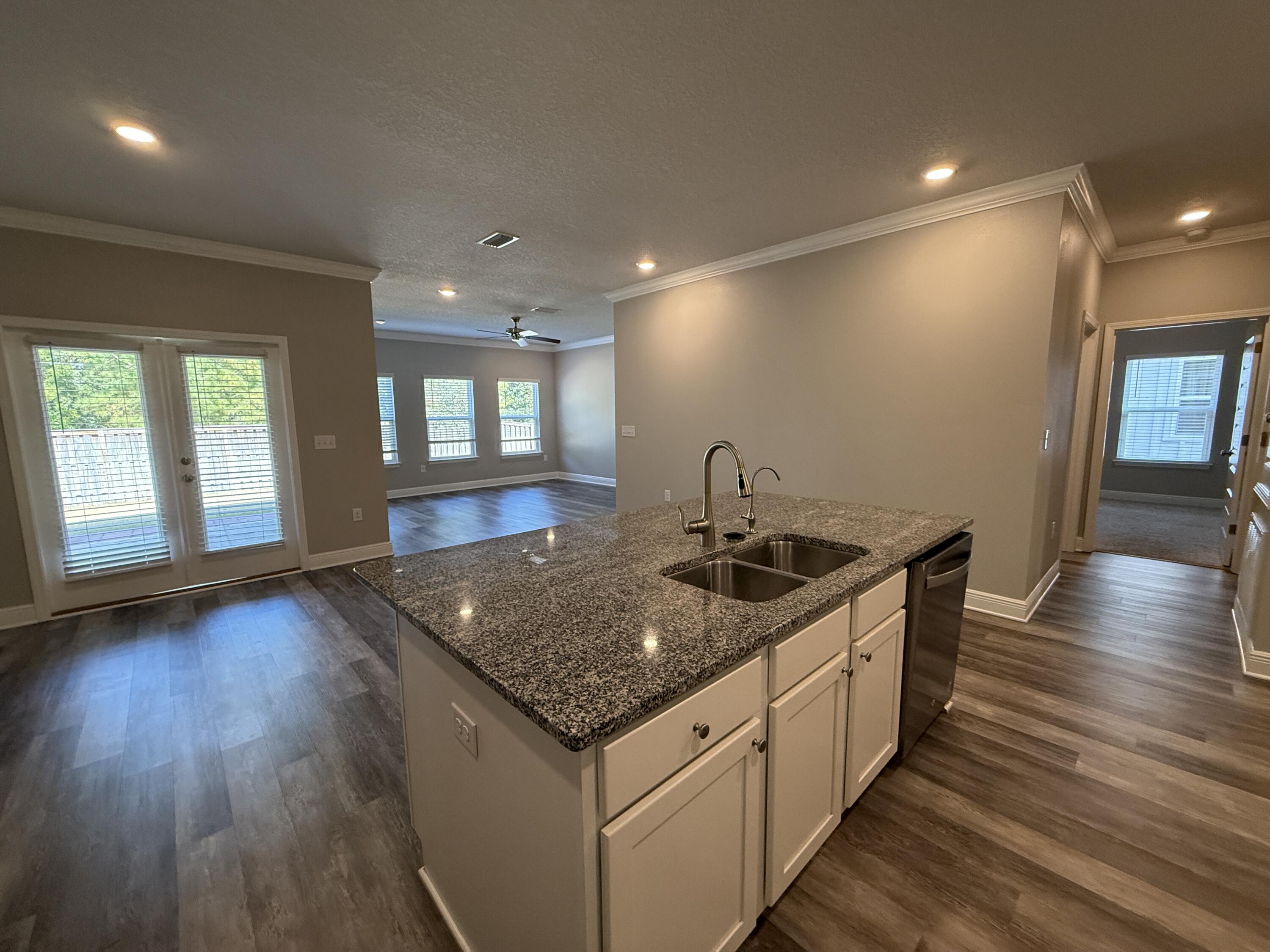 491 Lightning Bug Lane, Unit LOT 11 Freeport, FL 32439 - Photo 11 of 34 a kitchen with sink stove and refrigerator