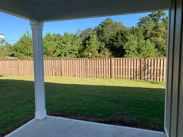a view of a porch with a backyard