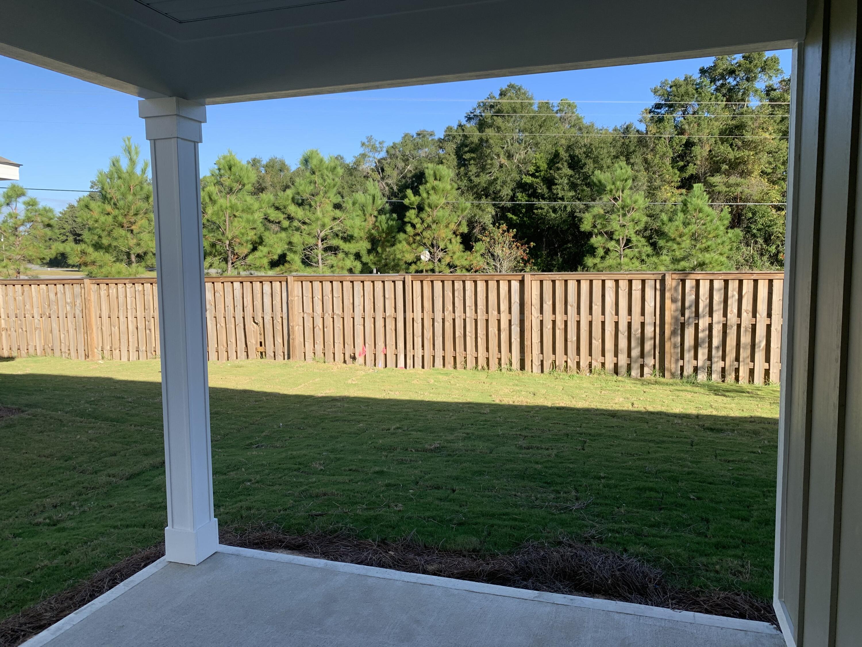 491 Lightning Bug Lane, Unit LOT 11 Freeport, FL 32439 - Photo 16 of 34 a view of a porch with a backyard