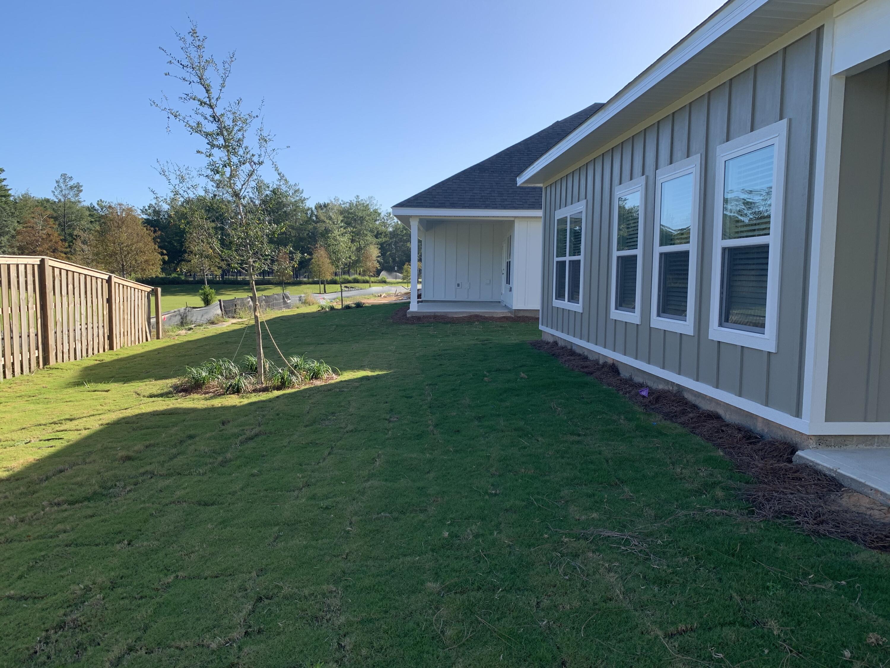 491 Lightning Bug Lane, Unit LOT 11 Freeport, FL 32439 - Photo 22 of 34 a view of a house with backyard and sitting area